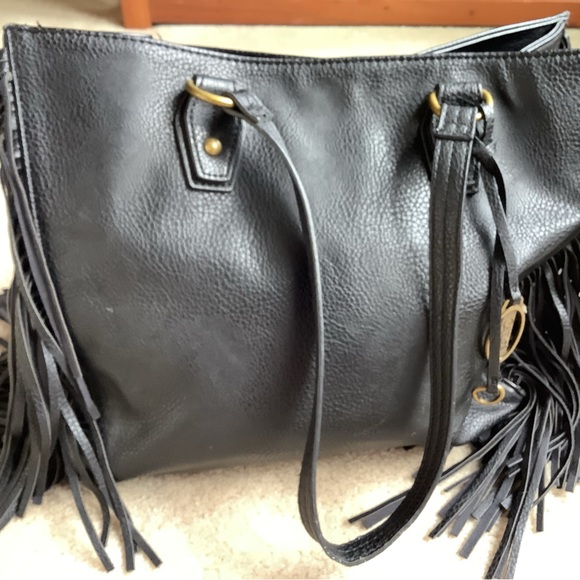 Carlos Santana Handbags - Genuine Leather Carlos Santana Blake fringe purse  ,signs of wear